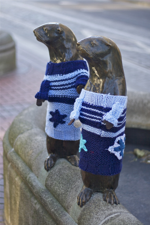 Yarnbombing puts rotating outfits on city statues.