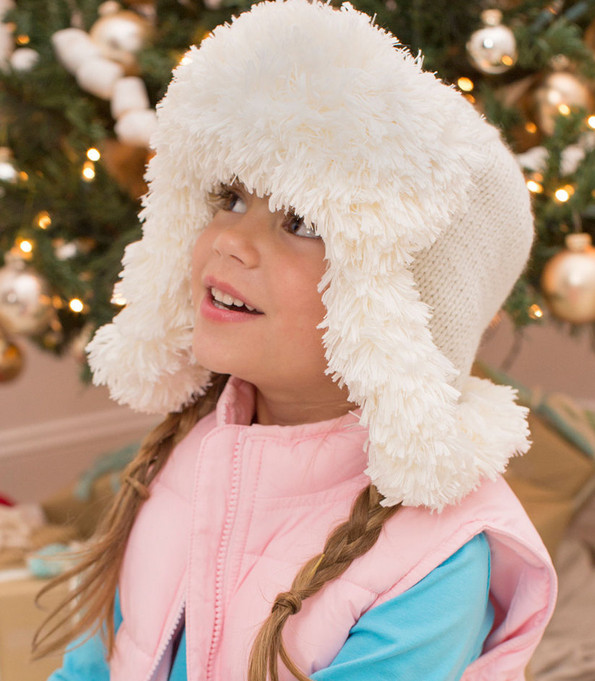 Knit a fun, fur-trimmed earflap hat in three sizes.