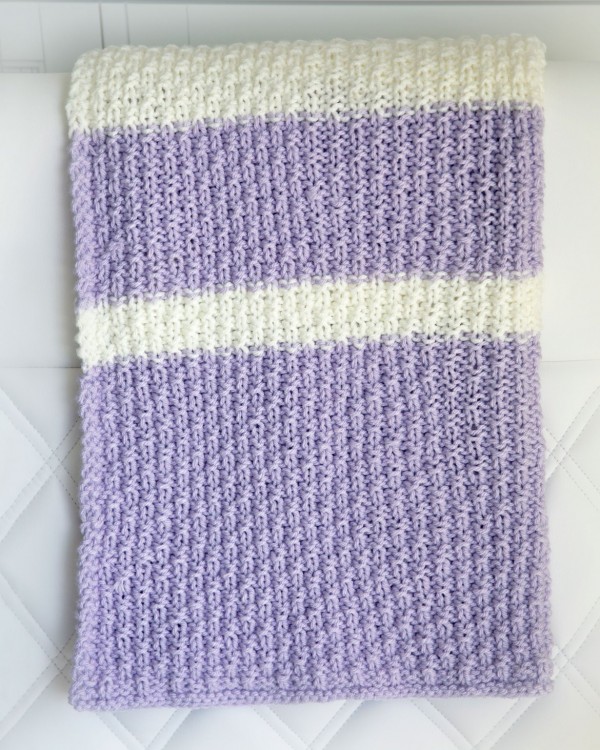 An easy textured and striped baby blanket to knit.