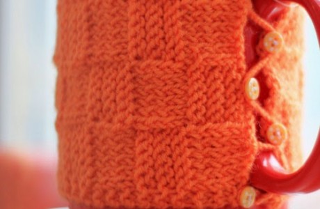 Knit a pretty mug cozy in basketweave stitch.