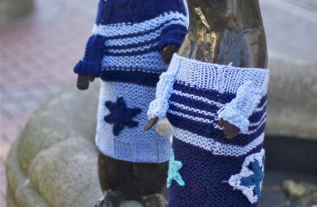 Yarnbombing puts rotating outfits on city statues.