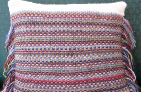 Knit a pillow with odd balls and use the ends as fringe.