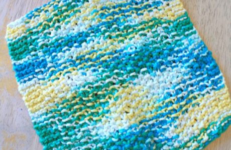 Knit a dishcloth in simple seed stitch.