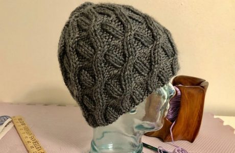 cabled messy bun hat knitting pattern